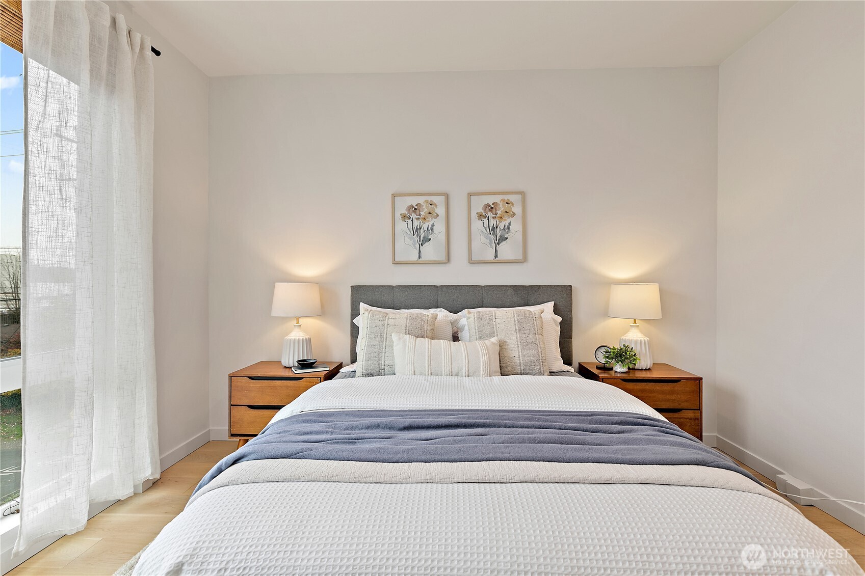 4100 37th Avenue South Seattle, WA 98118 - Photo 15 of 19 a bedroom with a bed and a night stand