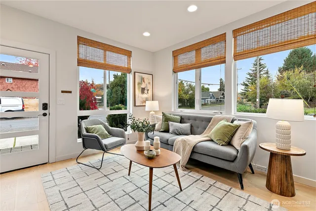 a living room with furniture and a large window