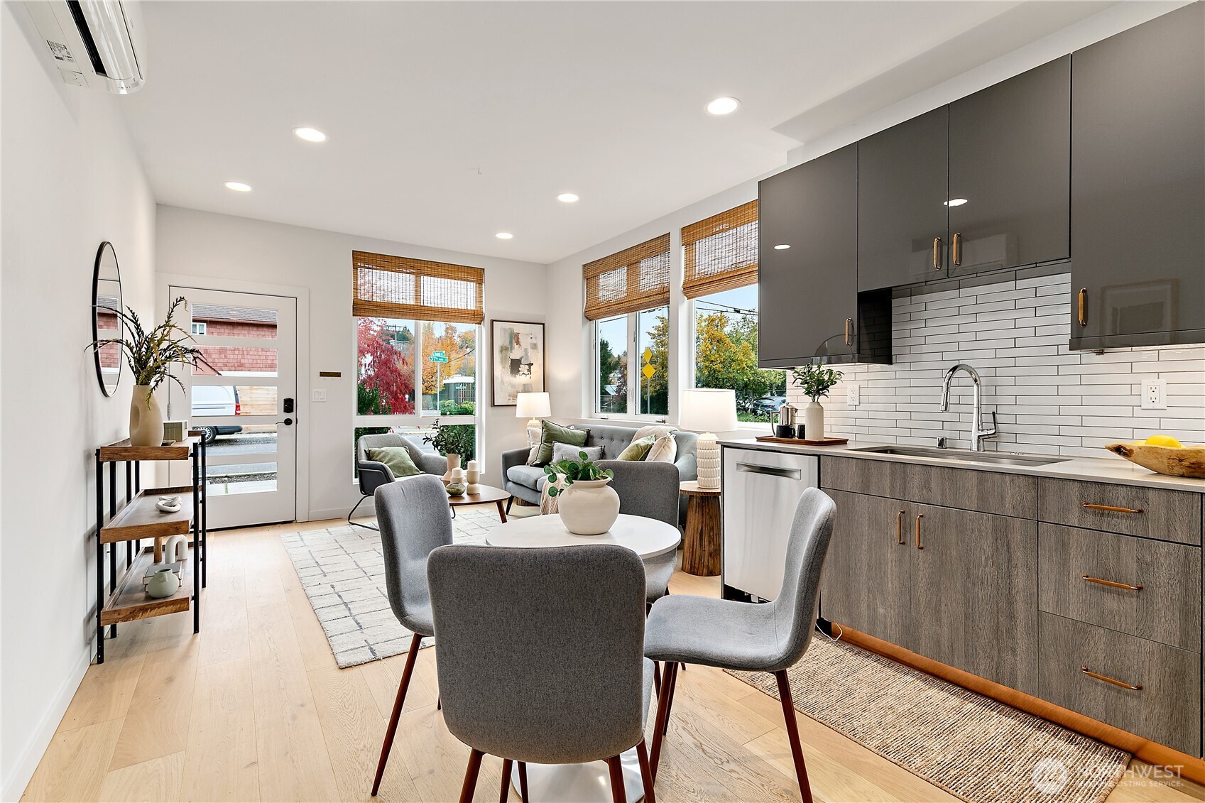 4100 37th Avenue South Seattle, WA 98118 - Photo 8 of 19 a very nice looking dining room with kitchen island stainless steel appliances furniture a large window and a sink