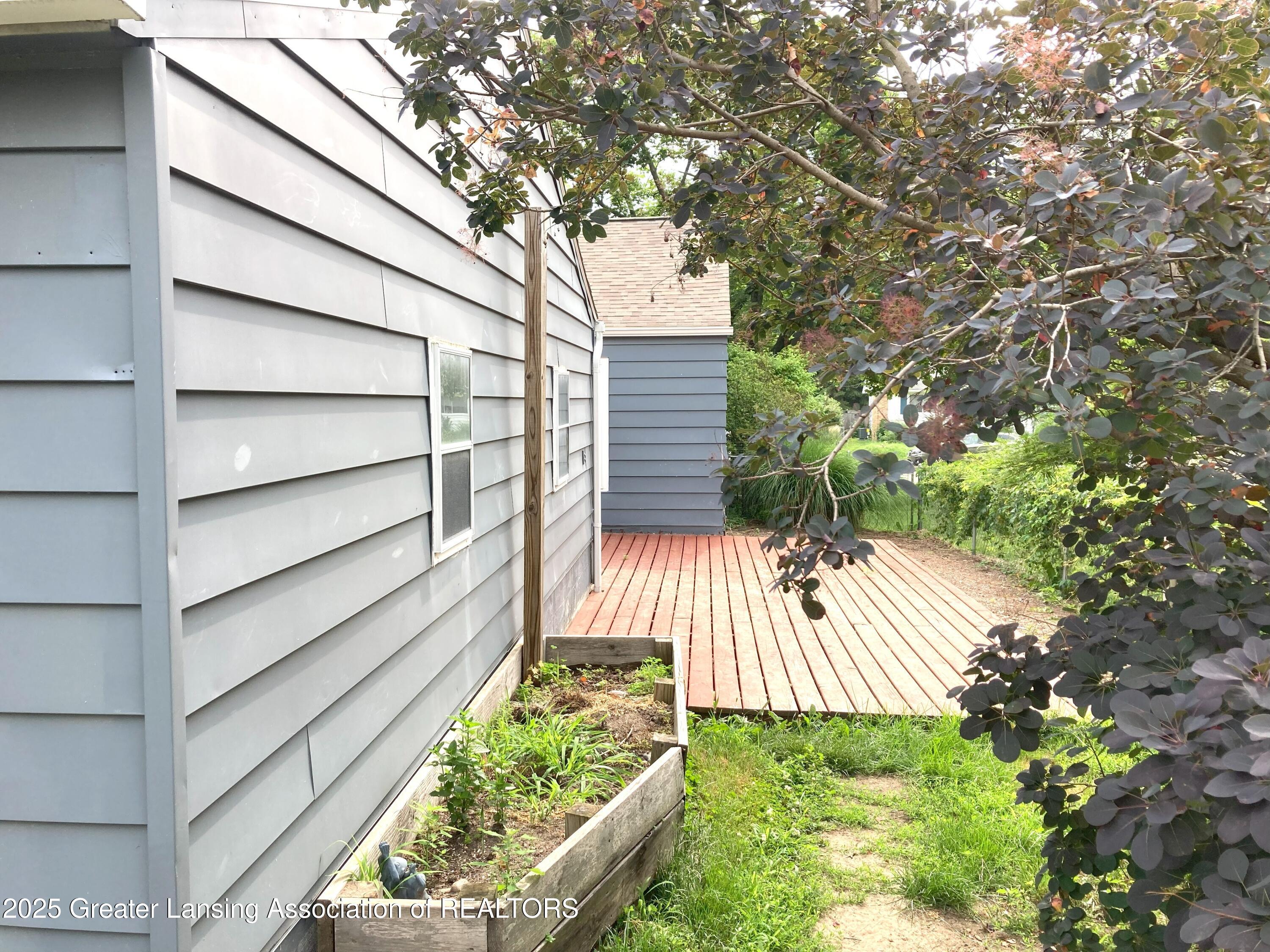 500 Spring Street Grand Ledge, MI 48837 - Photo 36 of 40 36 Side yard and Deck