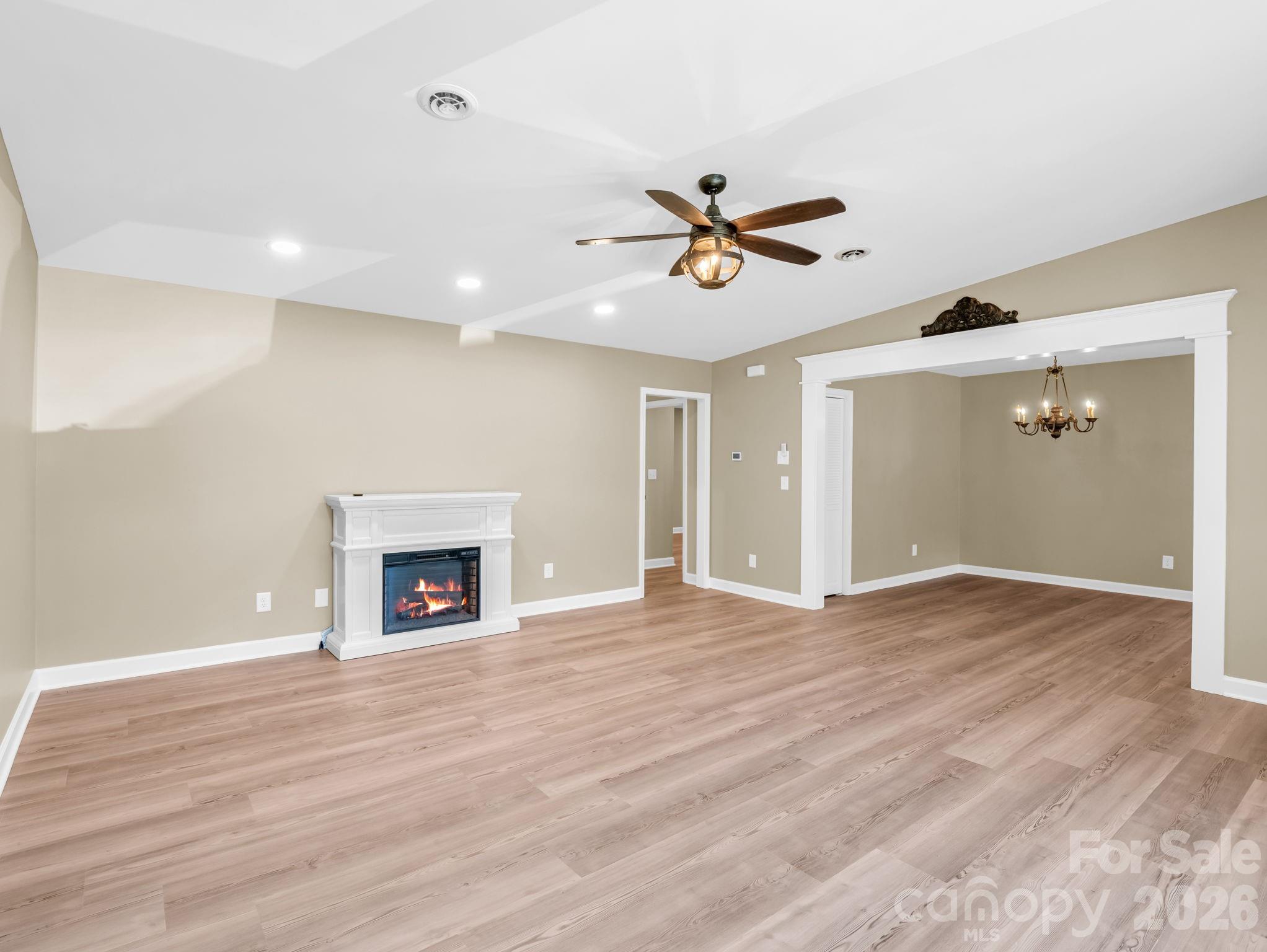 44 Jervey Road, Unit 4C Tryon, NC 28782 - Photo 3 of 35 a view of empty room with wooden floor and fireplace