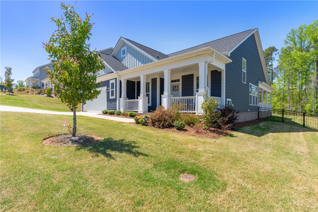 210 Maverick Trail Central, SC 29630 - Photo 3 of 41 This charming home offers a welcoming facade with classic architectural details and manicured landscaping.