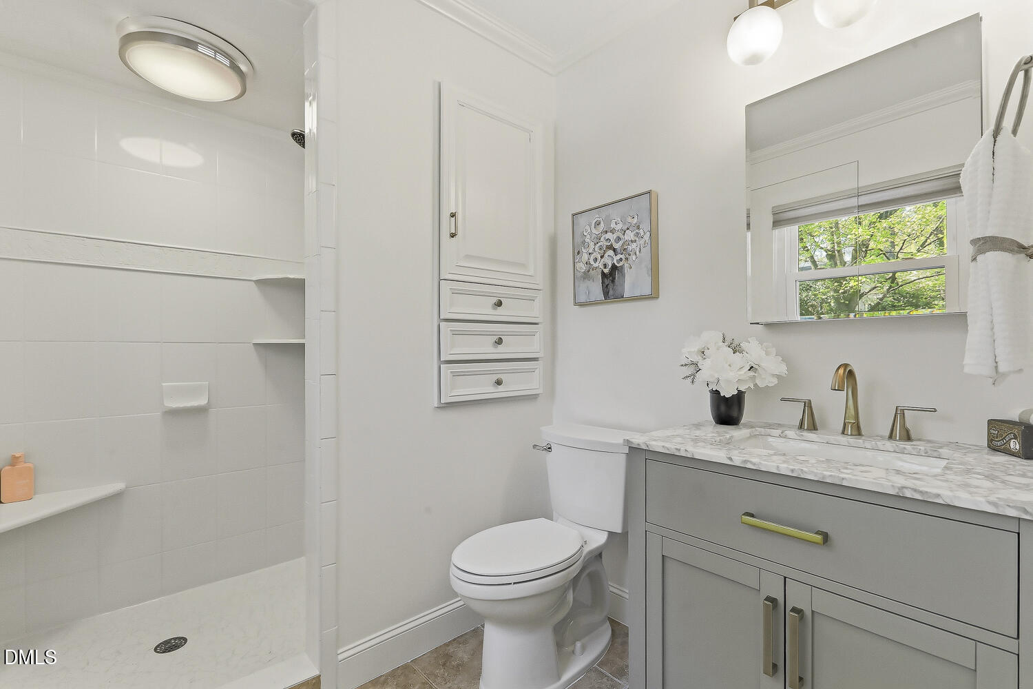 3704 Swann Street Raleigh, NC 27612 - Photo 12 of 21 a bathroom with a granite countertop toilet sink and mirror