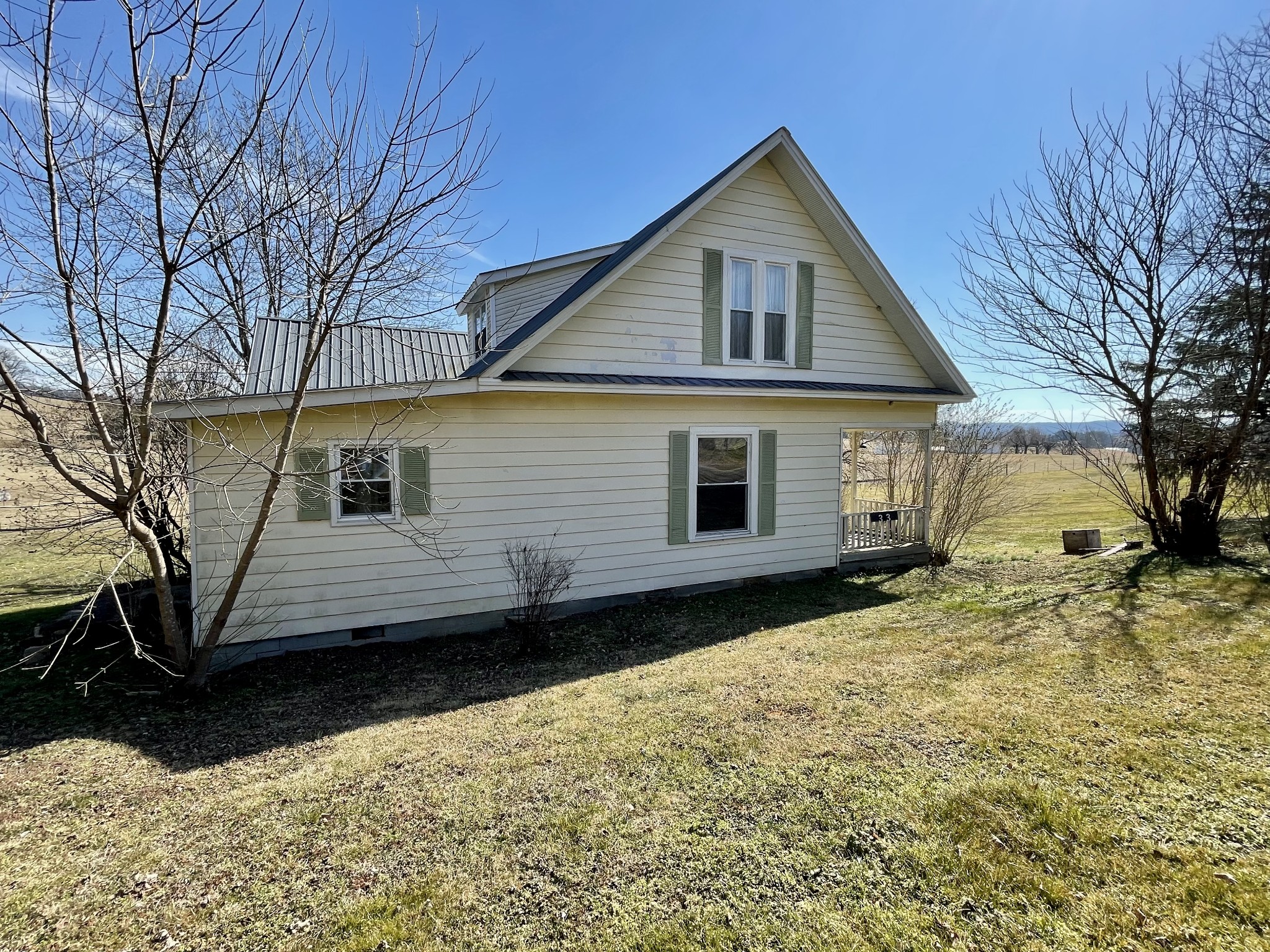 313 Smith Road Cornersville, TN 37047 - Photo 6 of 27 a view of a house with a yard covered with snow