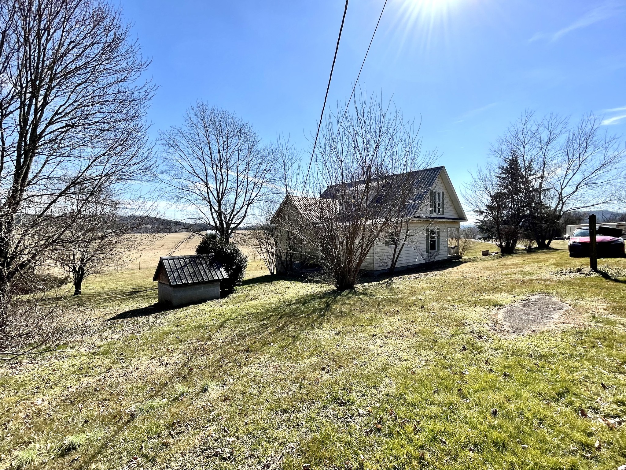 313 Smith Road Cornersville, TN 37047 - Photo 7 of 27 a view of a yard with a car parked beside of it
