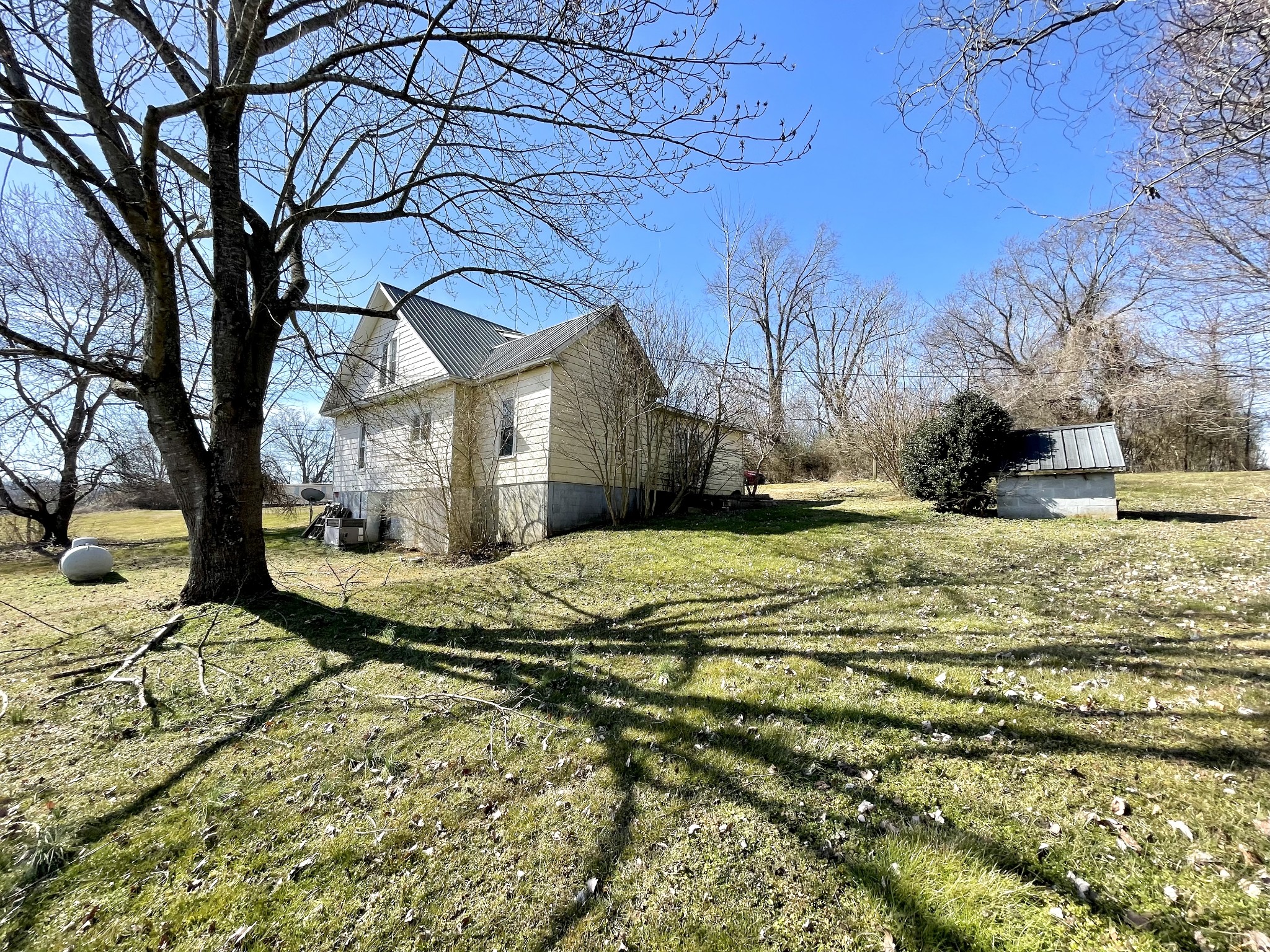 313 Smith Road Cornersville, TN 37047 - Photo 9 of 27 a view of a yard covered with snow in front of house