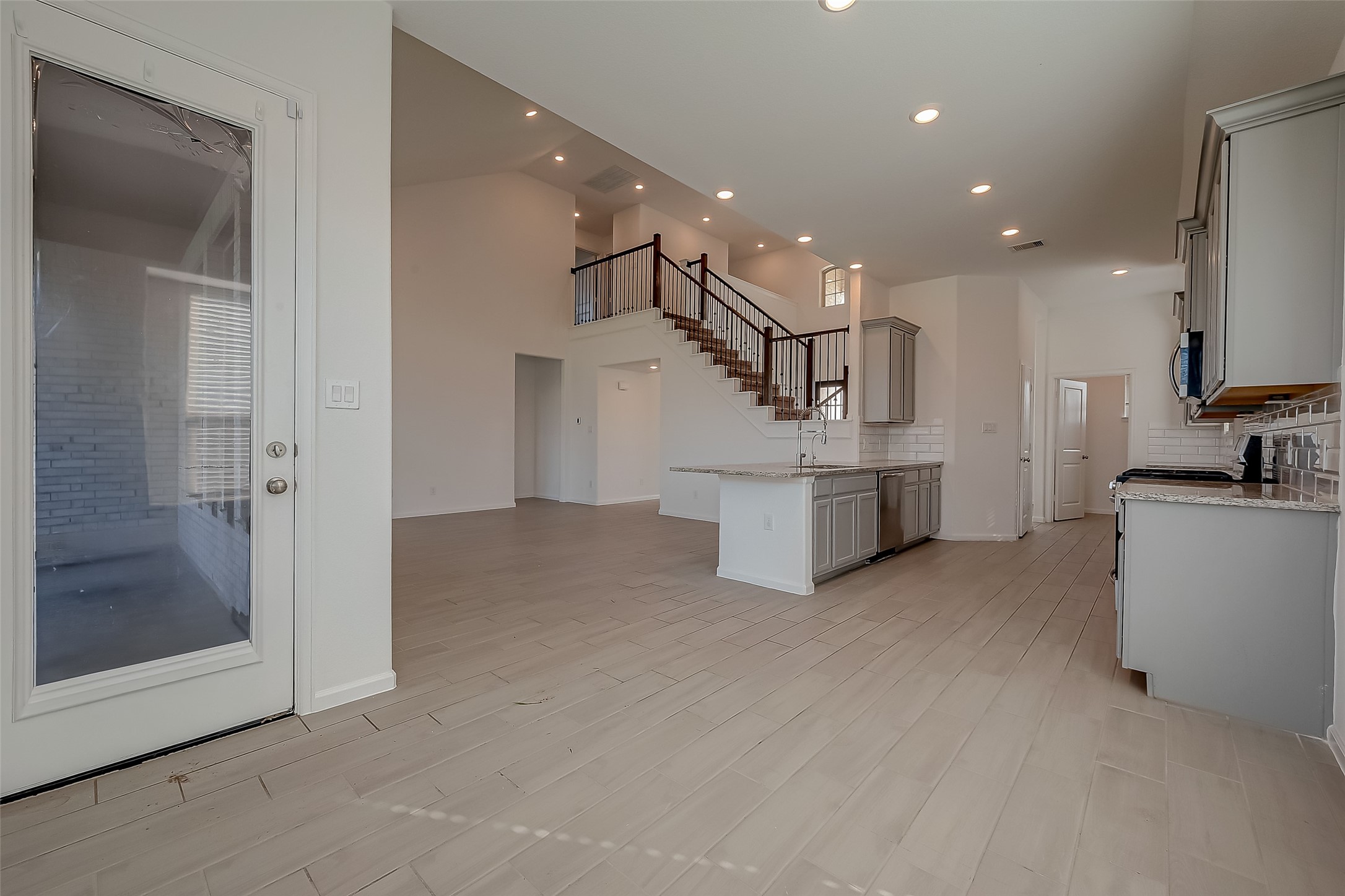 5010 Slate Prt Court Rosenberg, TX 77469 - Photo 13 of 39 a view of a kitchen with furniture and a ceiling fan