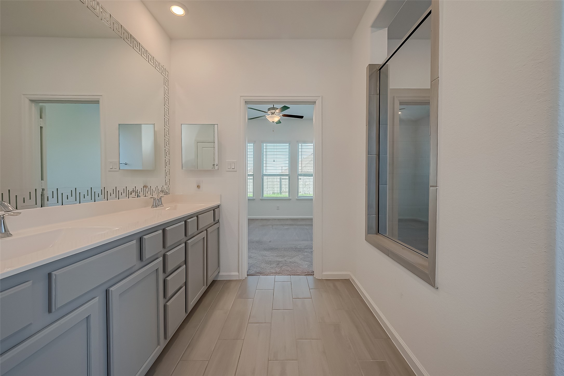 5010 Slate Prt Court Rosenberg, TX 77469 - Photo 32 of 39 a spacious bathroom with a shower a sink and a mirror