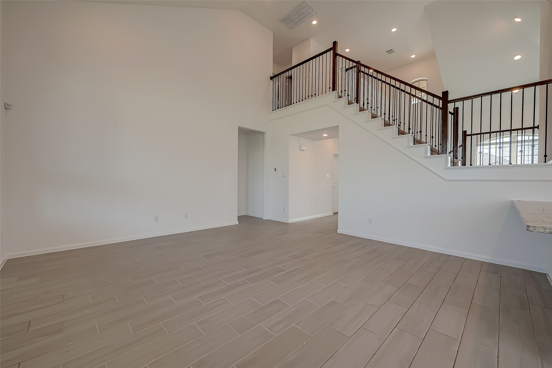 5010 Slate Prt Court Rosenberg, TX 77469 - Photo 9 of 39 a view of entryway and hall with wooden floor