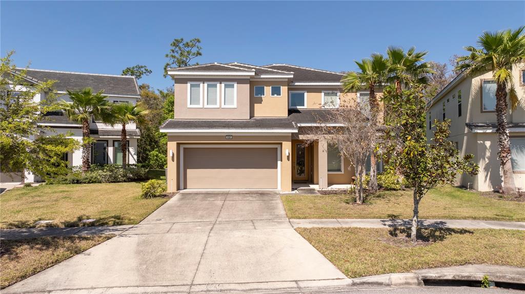 4561 Cabello Loop Kissimmee, FL 34746 - Photo 2 of 100 a front view of a house with a yard