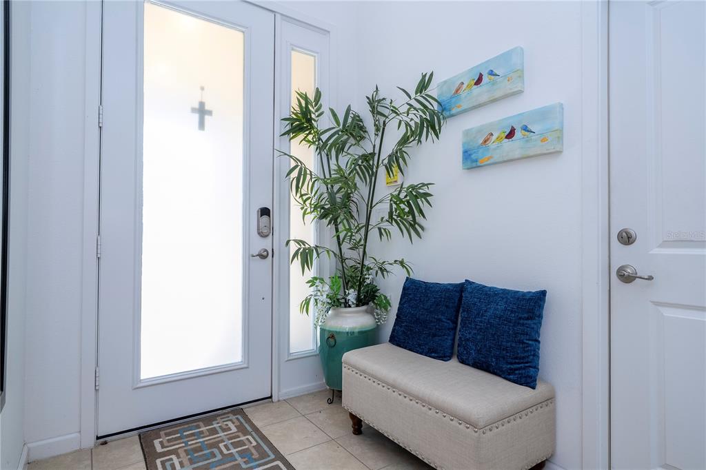 4561 Cabello Loop Kissimmee, FL 34746 - Photo 21 of 100 a living room with furniture and a potted plant