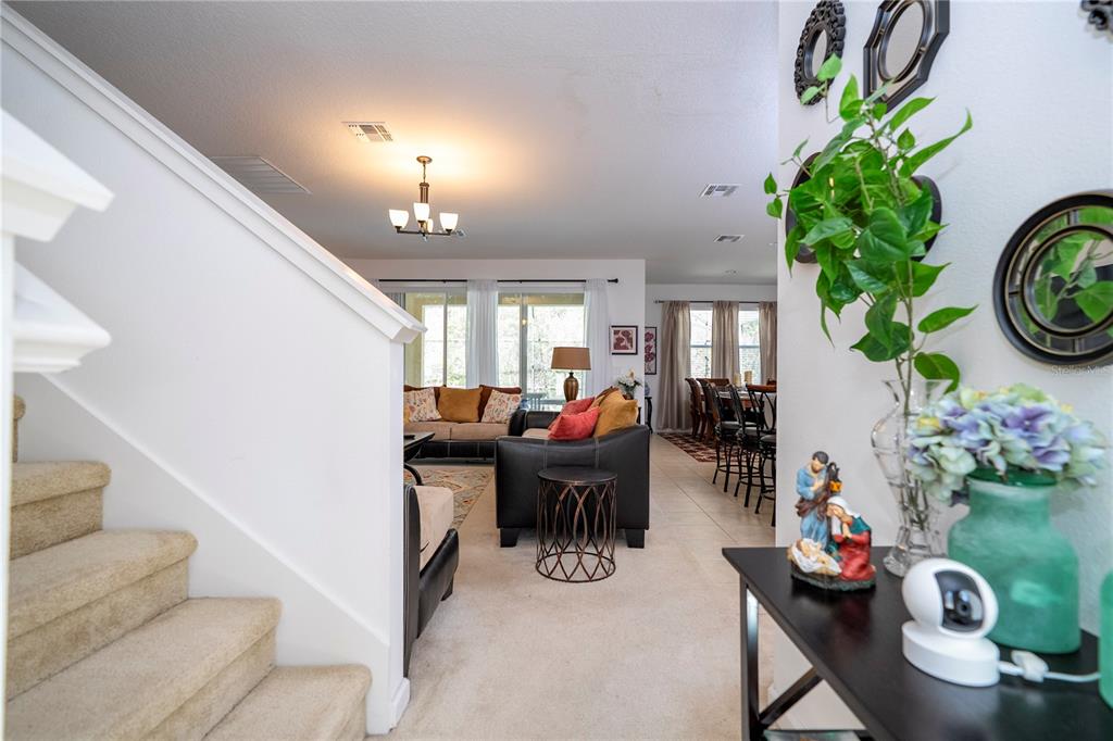 4561 Cabello Loop Kissimmee, FL 34746 - Photo 26 of 100 a living room with furniture and a potted plant