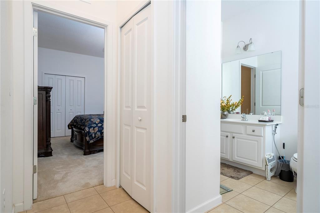 4561 Cabello Loop Kissimmee, FL 34746 - Photo 44 of 100 a bathroom with a sink and a mirror
