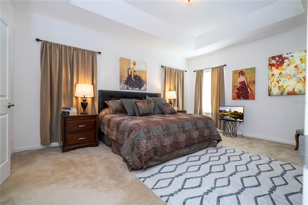 4561 Cabello Loop Kissimmee, FL 34746 - Photo 63 of 100 a bedroom with a bed and a window