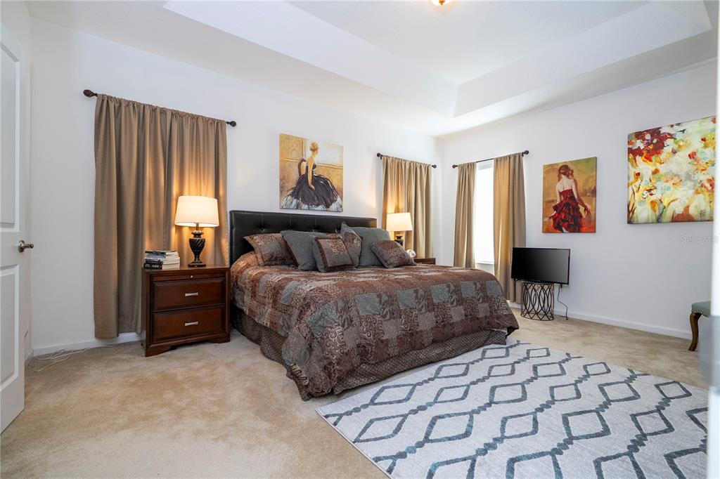 4561 Cabello Loop Kissimmee, FL 34746 - Photo 64 of 100 a bedroom with a bed and a window