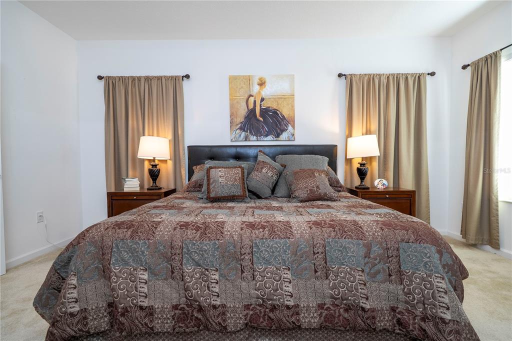 4561 Cabello Loop Kissimmee, FL 34746 - Photo 67 of 100 a bedroom with a bed and window