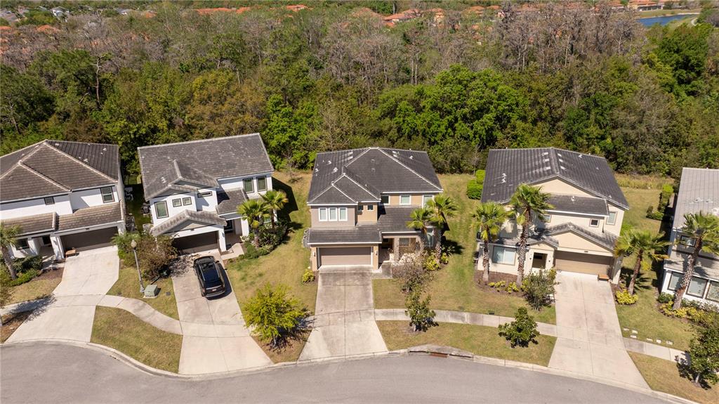 4561 Cabello Loop Kissimmee, FL 34746 - Photo 7 of 100 an aerial view of residential houses with outdoor space and parking