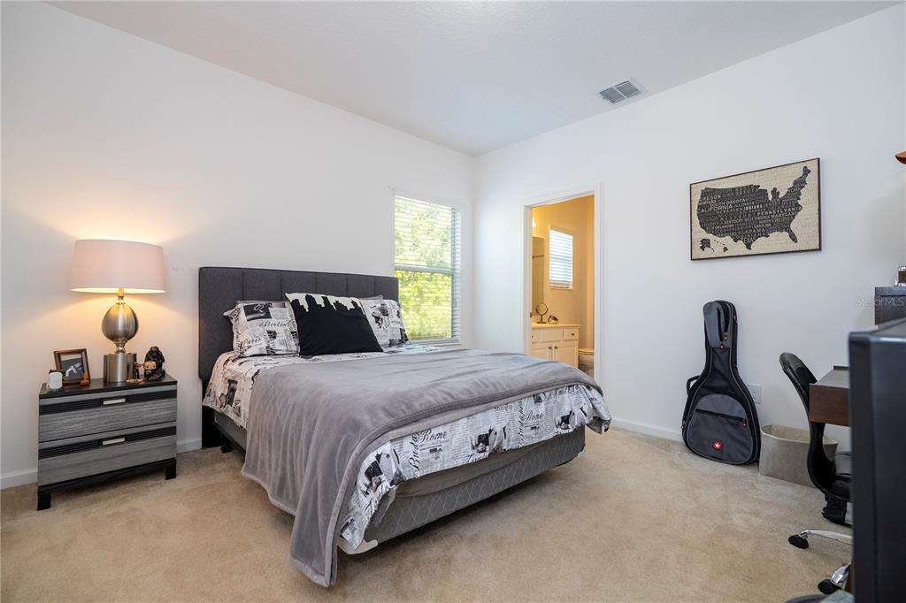 4561 Cabello Loop Kissimmee, FL 34746 - Photo 71 of 100 a bedroom with a bed and window