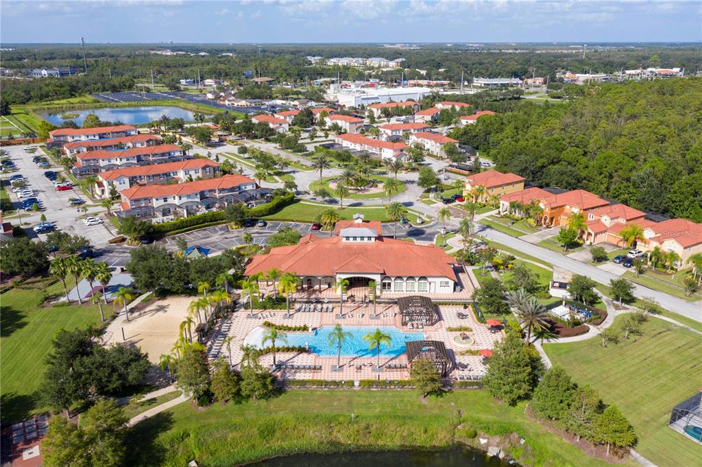 4561 Cabello Loop Kissimmee, FL 34746 - Photo 95 of 100 an aerial view of residential houses with outdoor space and trees