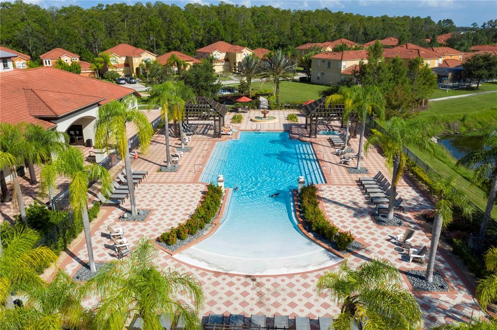 4561 Cabello Loop Kissimmee, FL 34746 - Photo 97 of 100 an aerial view of a swimming pool patio and mountain view in back