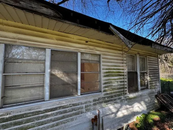 a view of a house with a door and a window