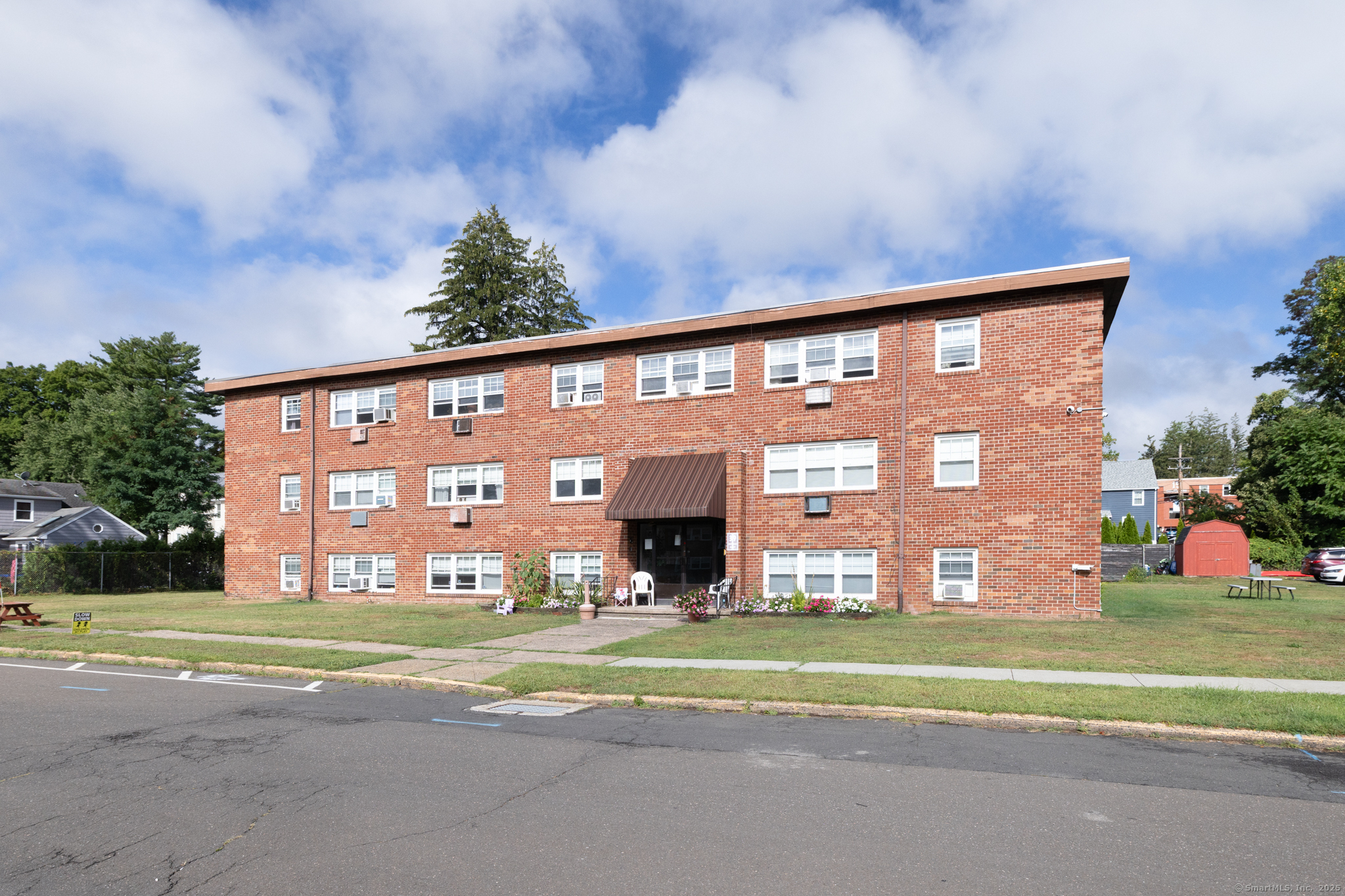 39 Hoffman Court, Unit B4 Wallingford, CT 06492 - Photo 1 of 1 a front view of building with yard