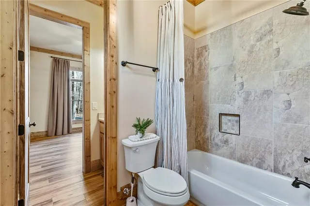 a en suite bathroom with a sink double vanity and a mirror