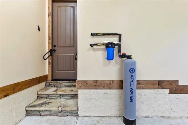 a large room with windows and balcony view