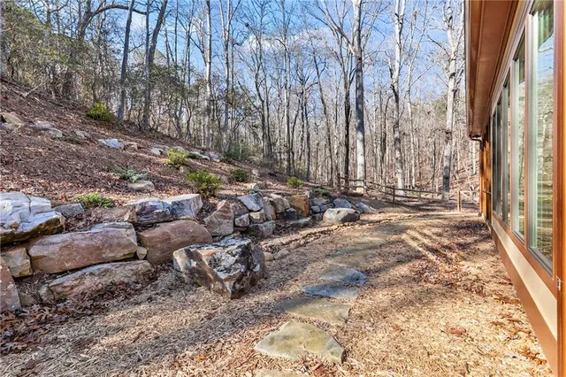 a view of a house with a yard and roof