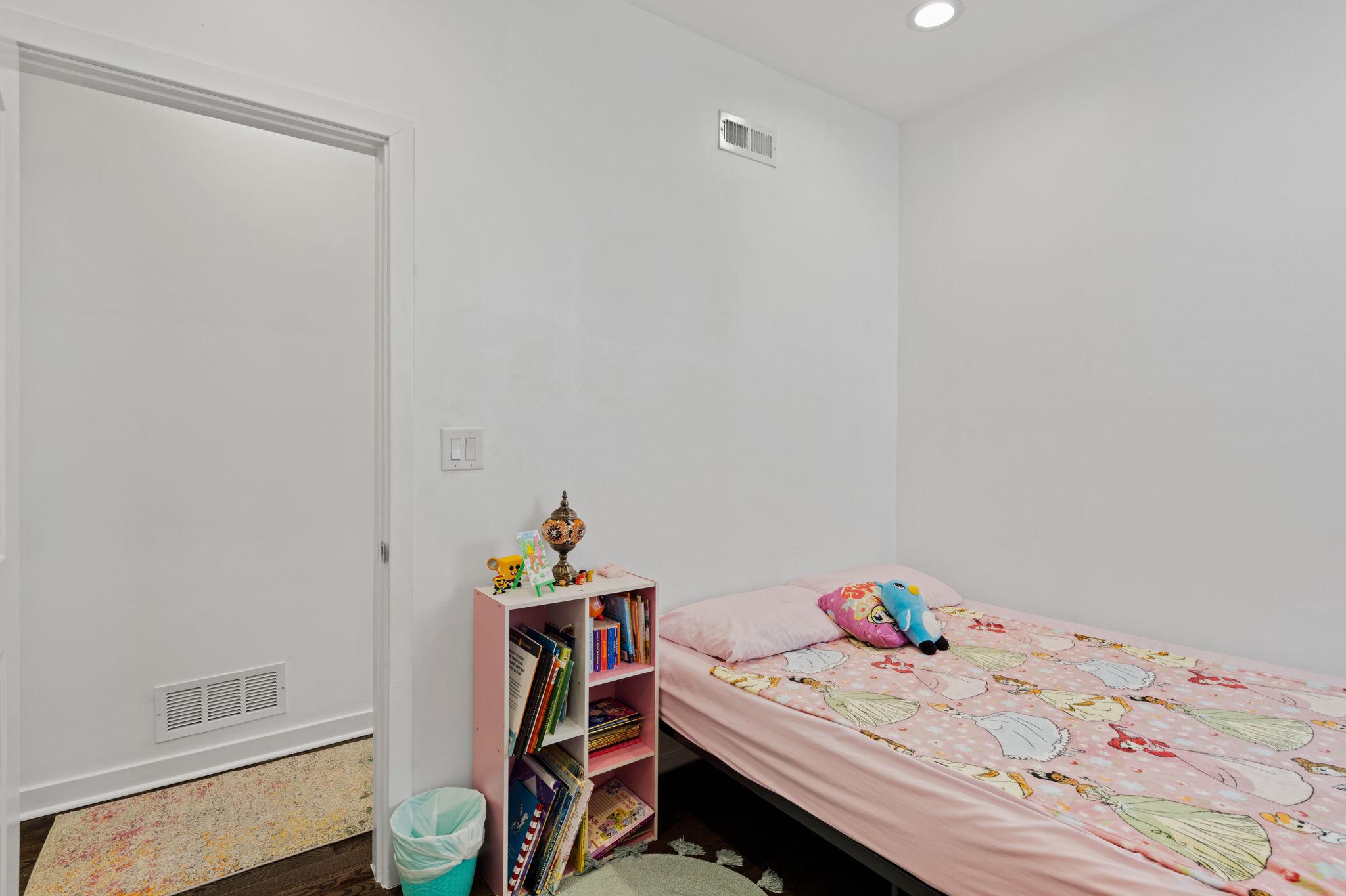 2924 Wharton Street Philadelphia, PA 19146 - Photo 17 of 29 a bedroom with a bed and a table in it
