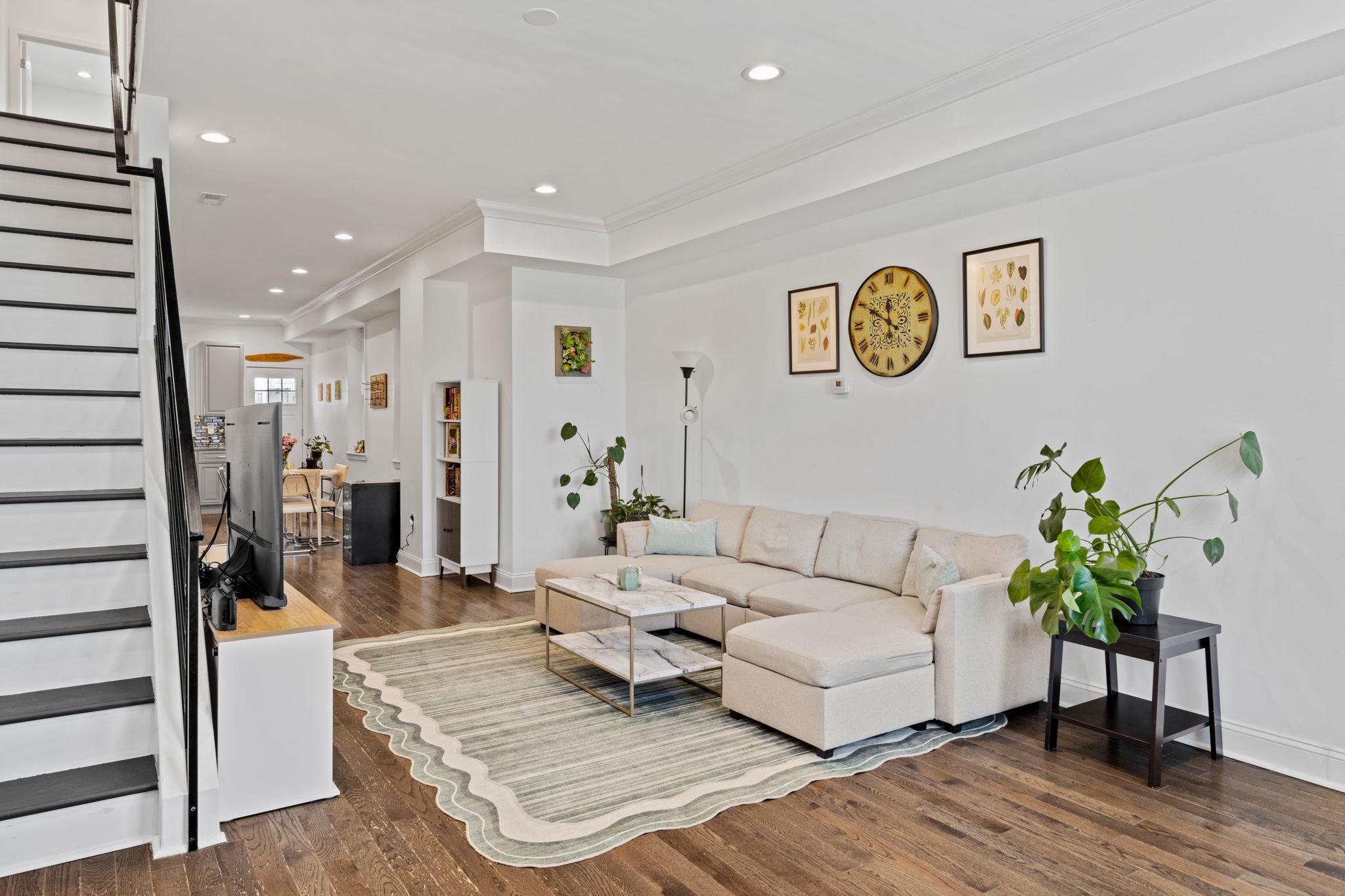 2924 Wharton Street Philadelphia, PA 19146 - Photo 2 of 29 a living room with furniture and a potted plant