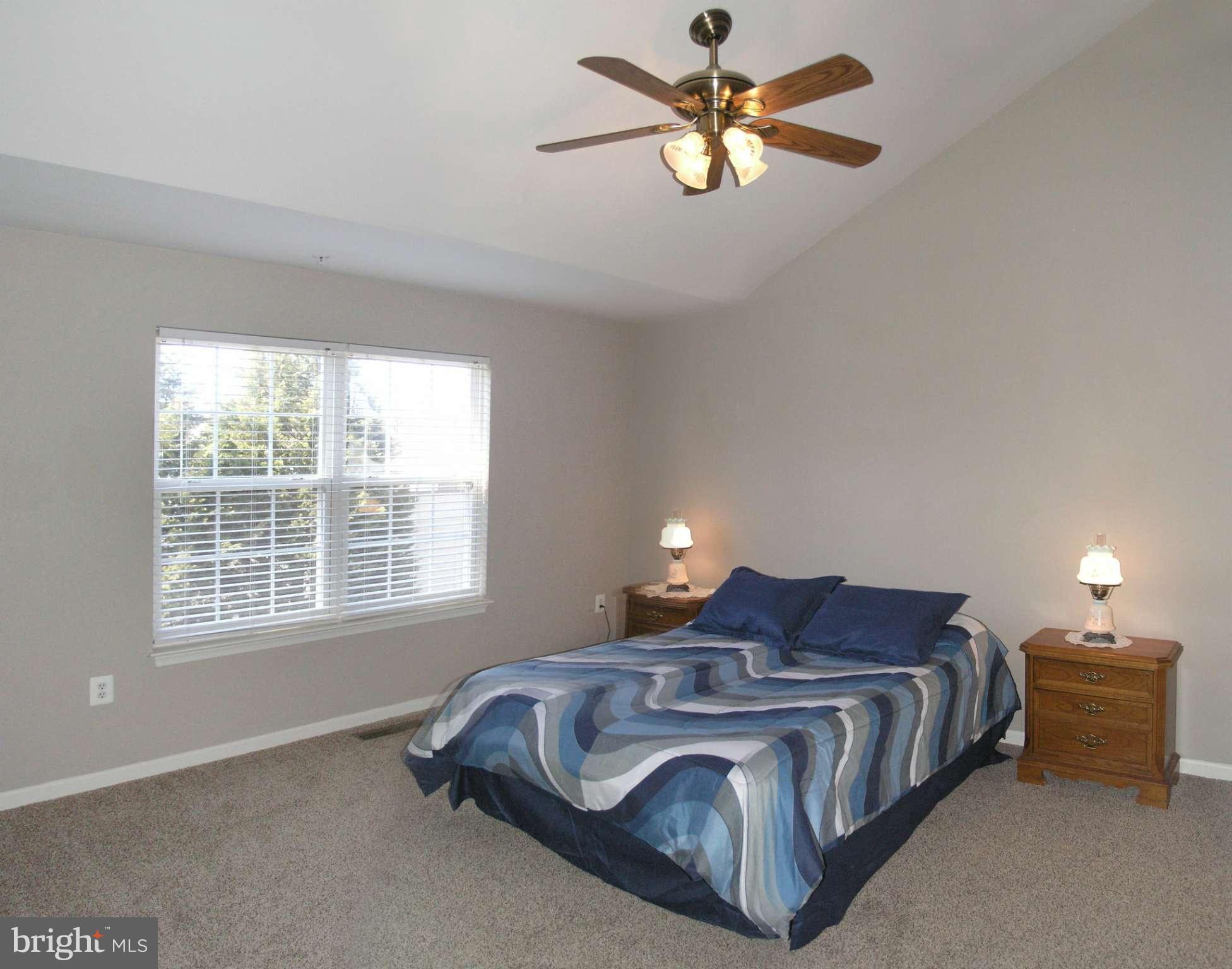 11894 Breton Court, Unit 7B Reston, VA 20191 - Photo 22 of 30 a spacious bedroom with a bed and a window