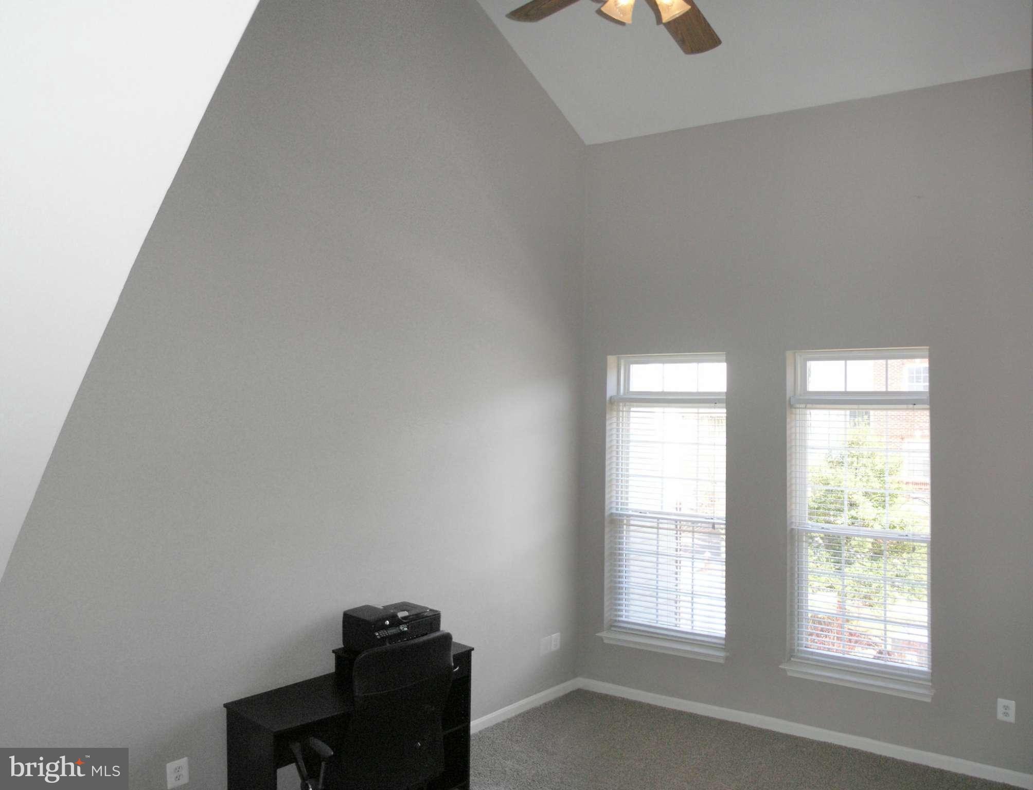 11894 Breton Court, Unit 7B Reston, VA 20191 - Photo 4 of 30 an empty room with windows
