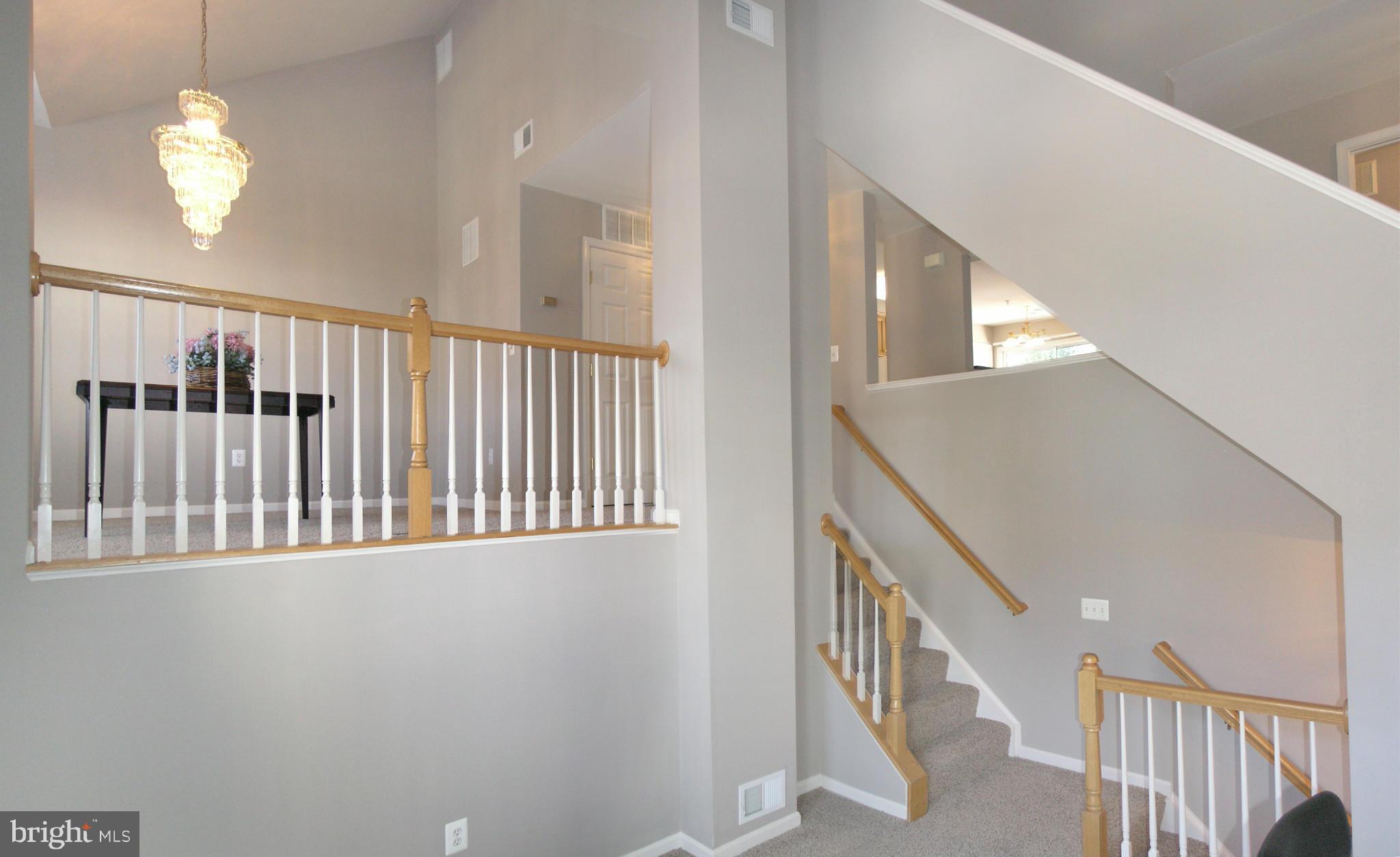 11894 Breton Court, Unit 7B Reston, VA 20191 - Photo 5 of 30 a view of staircase with railing and a window
