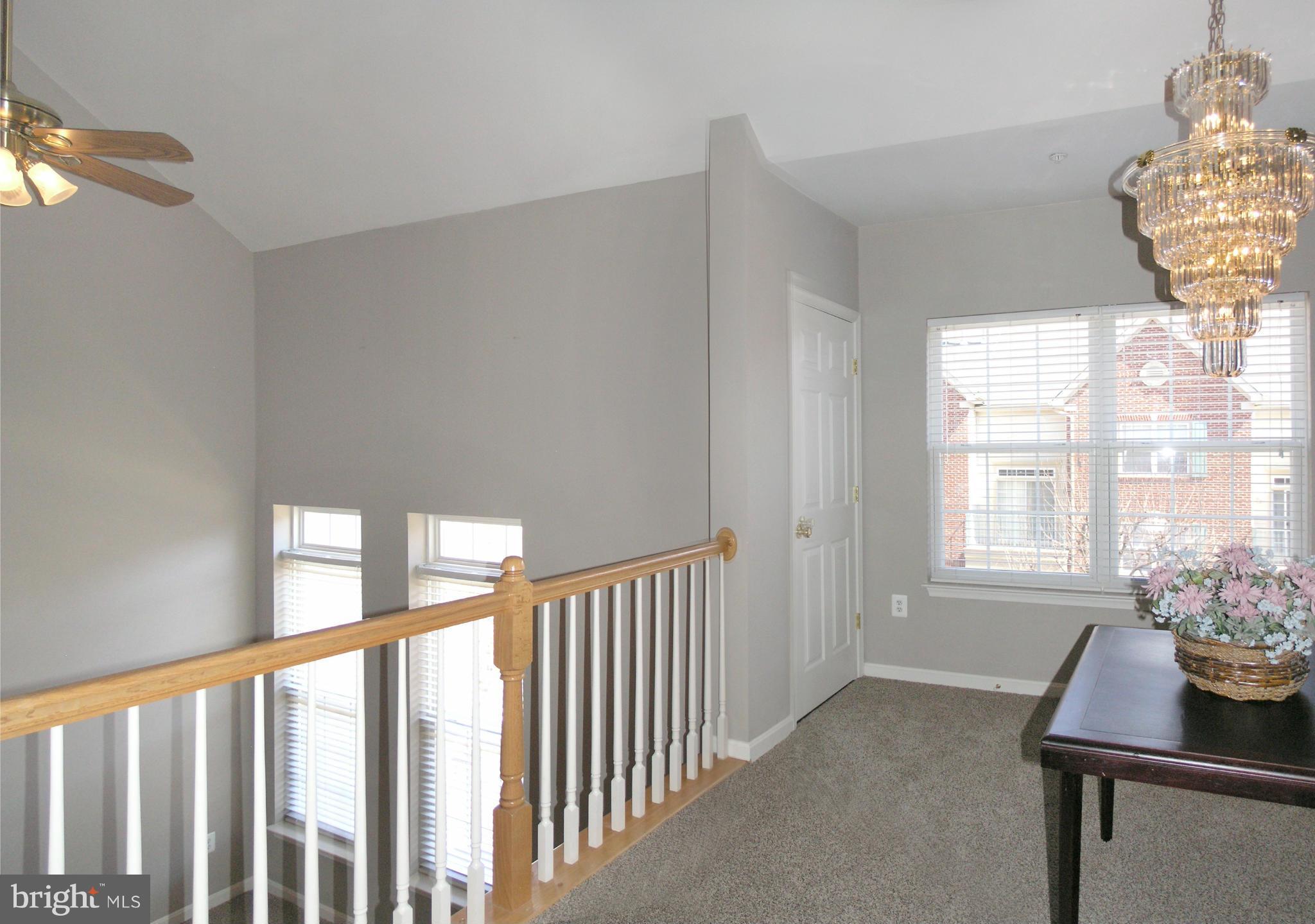 11894 Breton Court, Unit 7B Reston, VA 20191 - Photo 10 of 30 a view of an empty room with a window