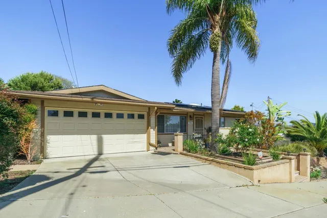 a backyard of a house with wooden fence