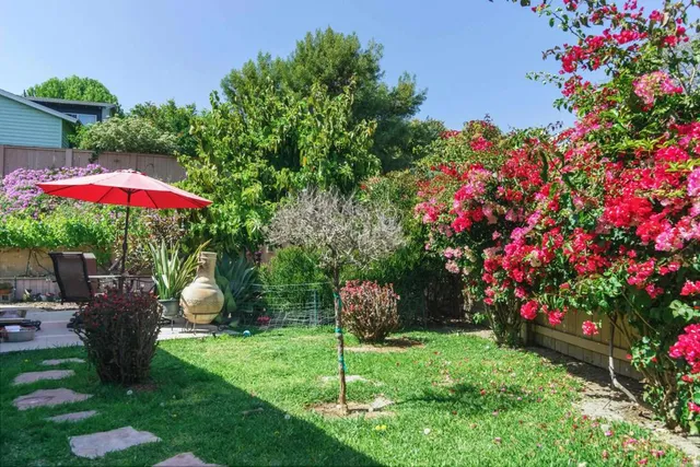 a view of yard with patio