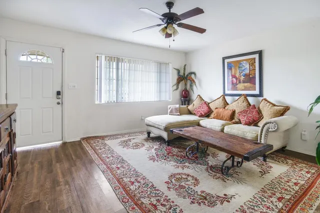 a living room with a couch and a window