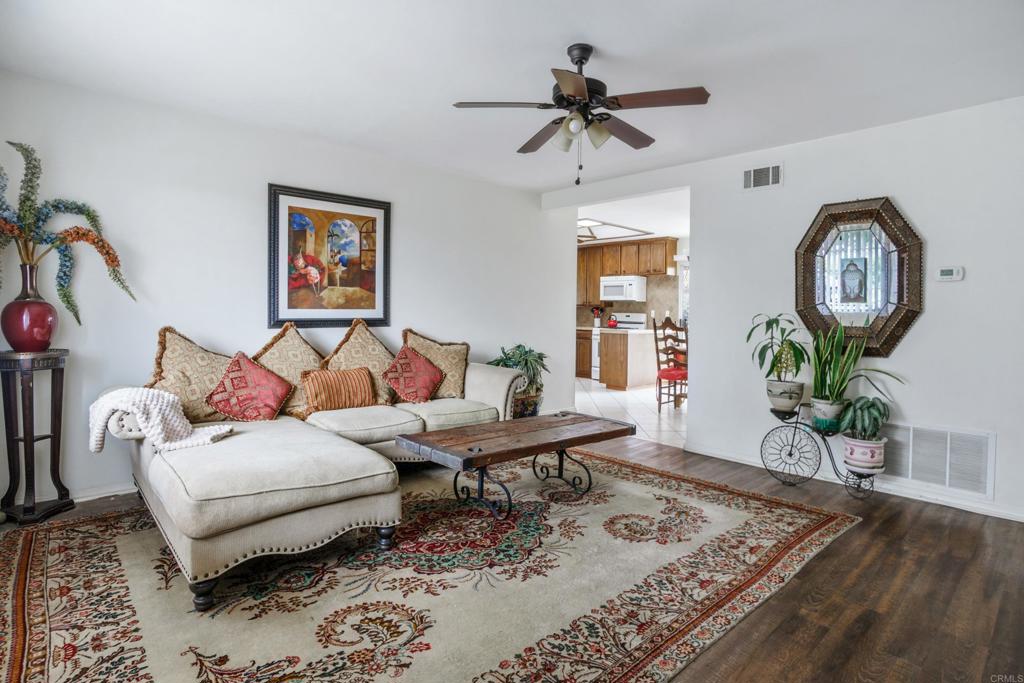 306 Fowles Street Oceanside, CA 92054 - Photo 4 of 29 a living room with furniture and a wooden floor