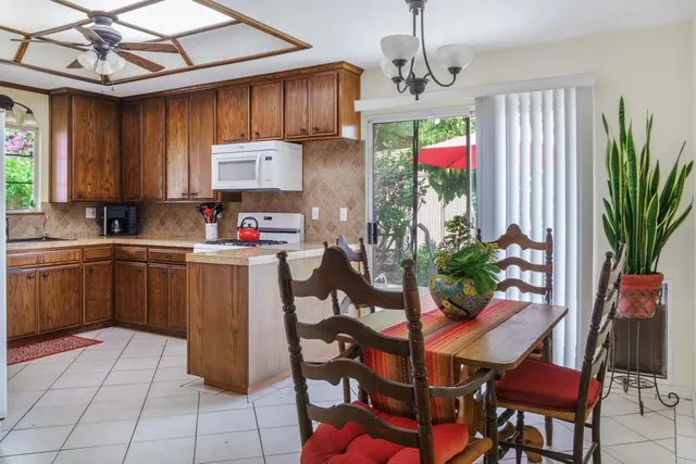 a kitchen with a sink cabinets and window