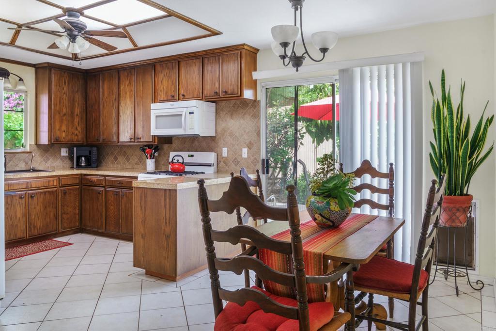 306 Fowles Street Oceanside, CA 92054 - Photo 6 of 29 a kitchen with a sink cabinets and window