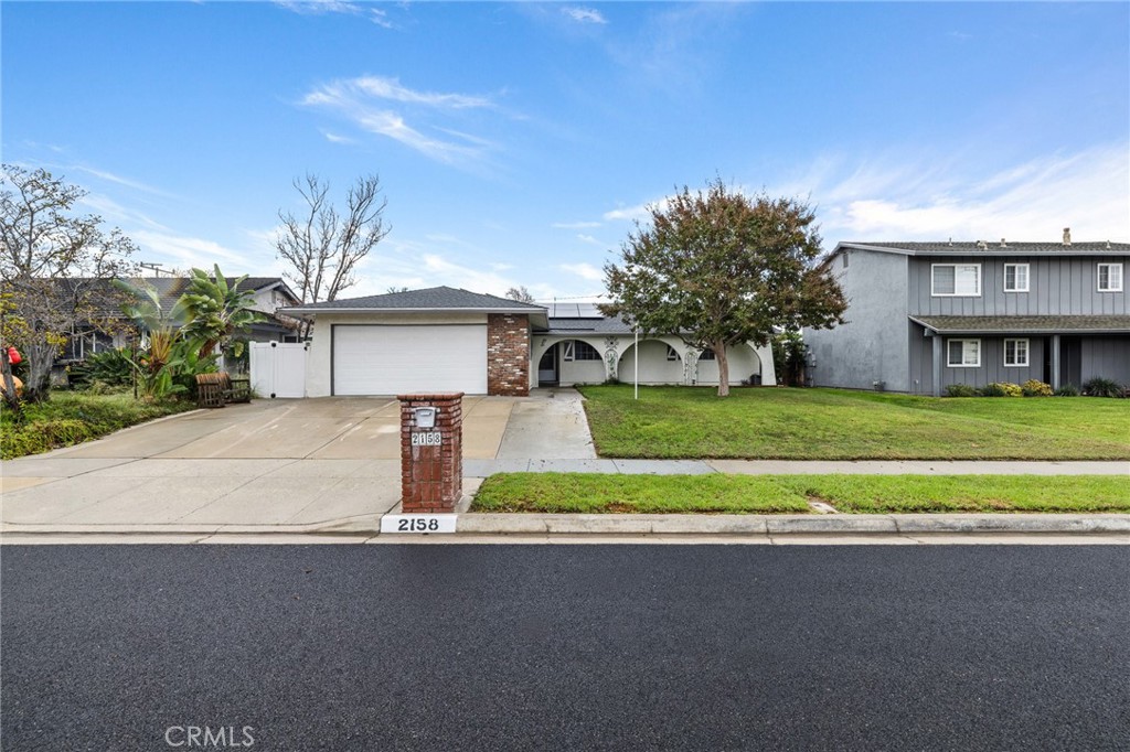 a house view with a garden space