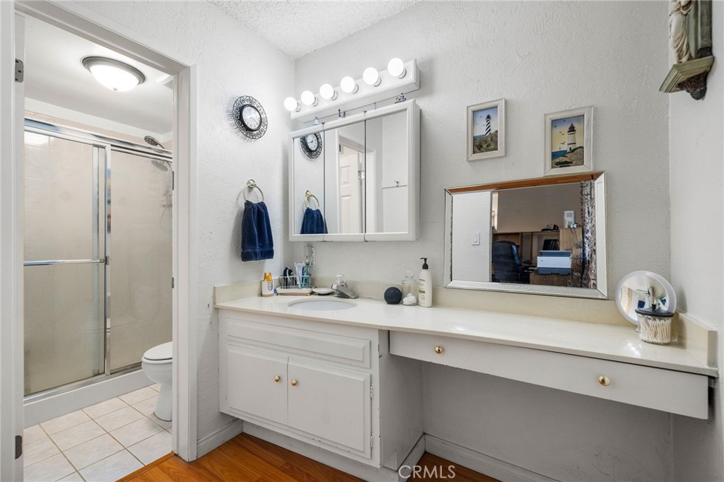 2158 Waldo Street Simi Valley, CA 93065 - Photo 21 of 46 a bathroom with a sink a light fixture and a mirror