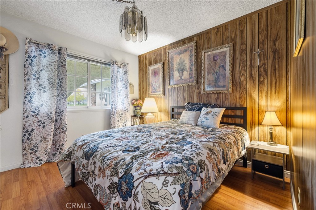 2158 Waldo Street Simi Valley, CA 93065 - Photo 23 of 46 a bedroom with a bed and a chandelier