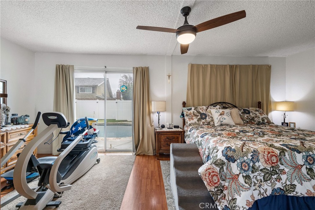 2158 Waldo Street Simi Valley, CA 93065 - Photo 24 of 46 a bed room with a bed and a chandelier