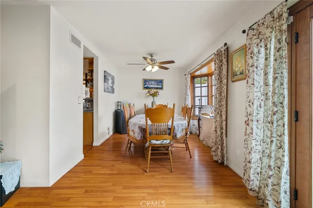 a workspace with wooden floor and a rug