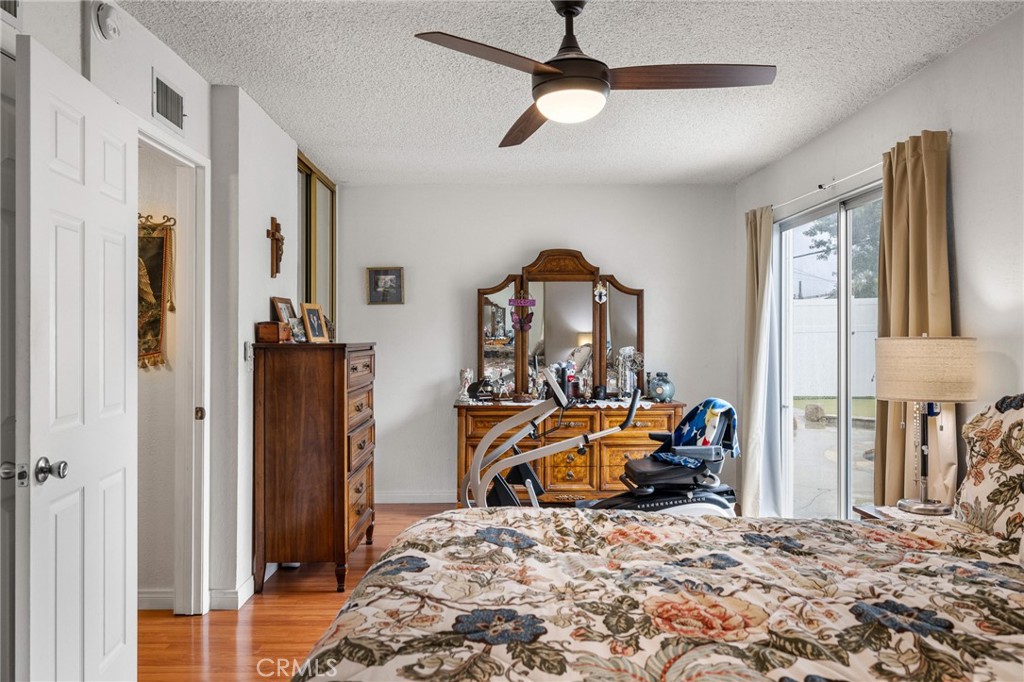 2158 Waldo Street Simi Valley, CA 93065 - Photo 26 of 46 a bedroom with a bed and a chandelier