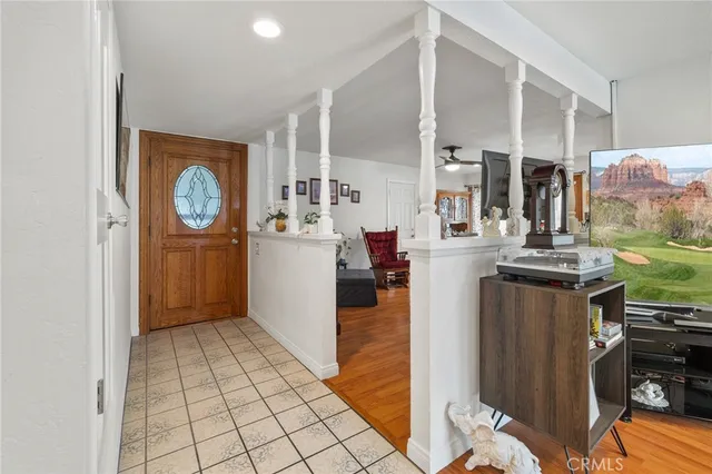 a view of kitchen with windows and refrigerator