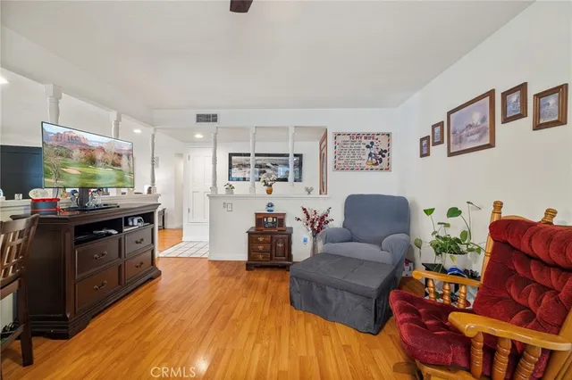 a living room with furniture and flat screen tv