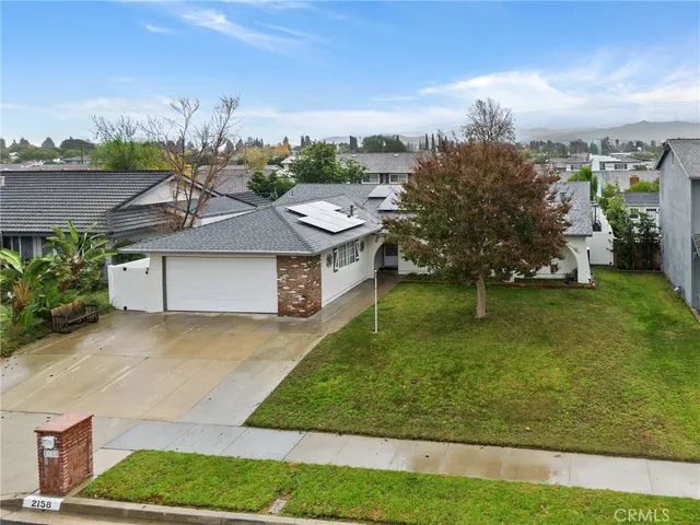 a front view of house with garden